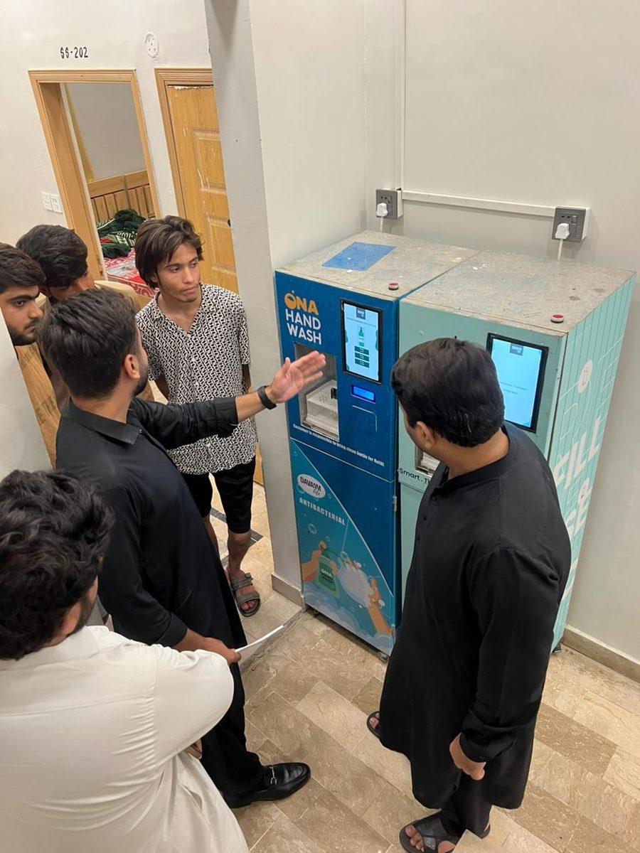 Customers using a Davaam hand wash refill station