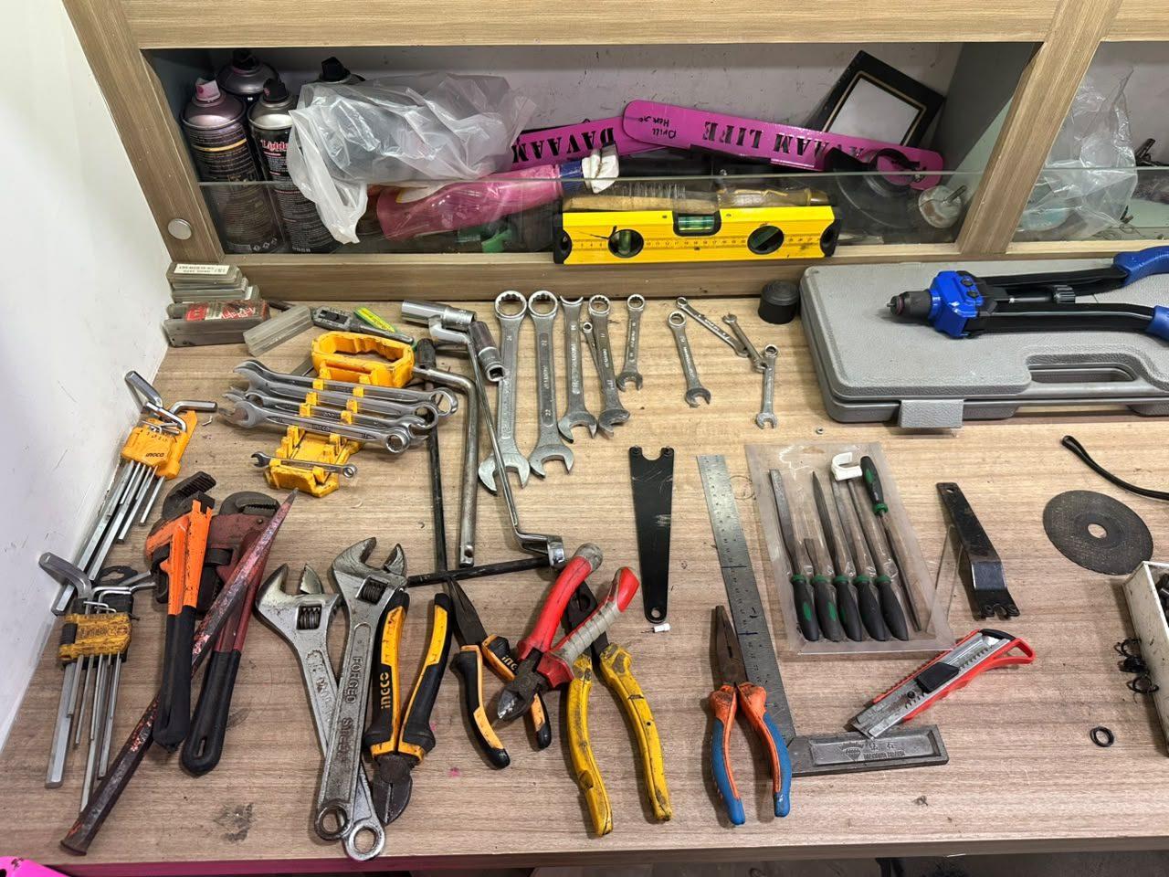 Hand tools laid out on a bench